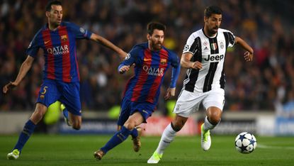 Sami Khedira of Juventus and Lionel Messi of Barcelona