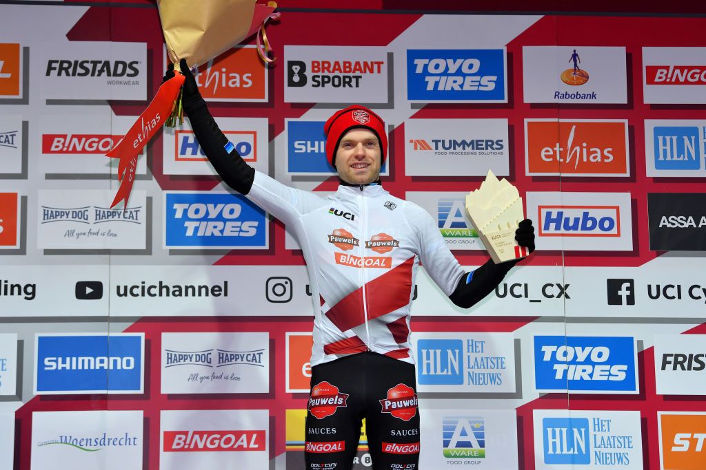 HOOGERHEIDE NETHERLANDS JANUARY 23 Eli Iserbyt of Belgium and Team Pauwels Sauzen Bingoal celebrates winning the UCI WorldTour Leader Jersey on the podium ceremony after the 32nd GP Adrie Van der Poel Hoogerheide UCI CycloCross Worldcup 2022 Mens Elite CXWorldCup on January 23 2022 in Hoogerheide Netherlands Photo by Luc ClaessenGetty Images