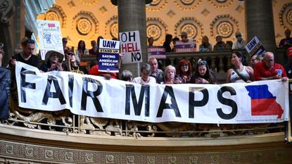 People gather at the Missouri statehouse in Jefferson City to protest the legislature's efforts to change the state's congressional district maps