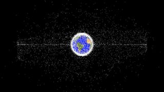 A visualization of Earth in the center with many (many) white dots representing space debris.