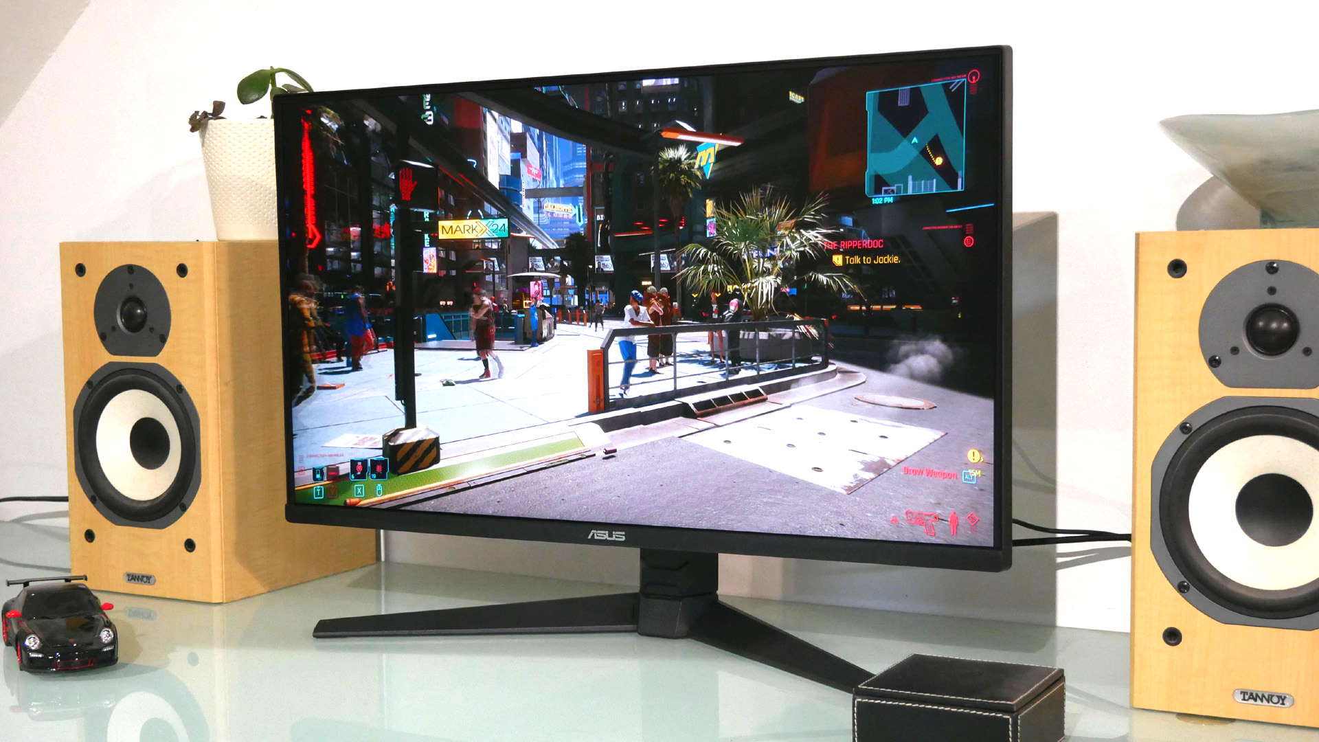 Asus TUF VG28UQL1A gaming monitor with Cyberpunk 2077 on the screen