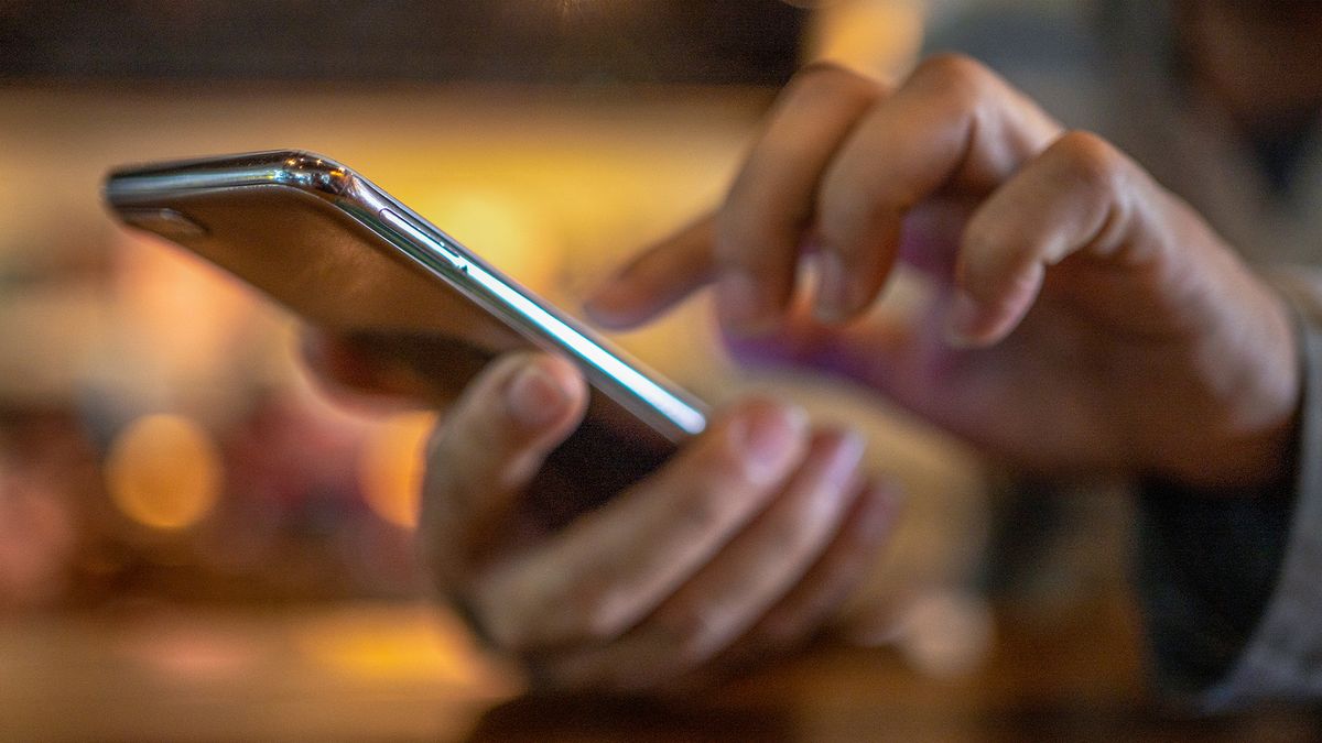 A man holding a smart phone