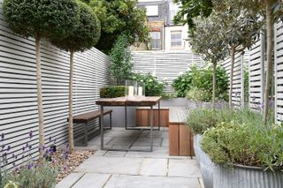 painting makes the fence last longer and it is a popular choice as it allows you to extend the interior colour scheme into the garden quite seamlessly