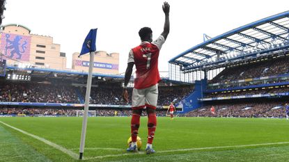 Bukayo Saka of Arsenal prepares to take a corner during the Premier League match between Chelsea FC and Arsenal FC at Stamford Bridge on November 06, 2022 in London, England