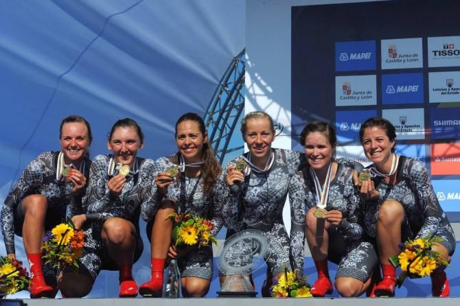 Specialized-lululemon riders pose with their third gold medal in the TTT