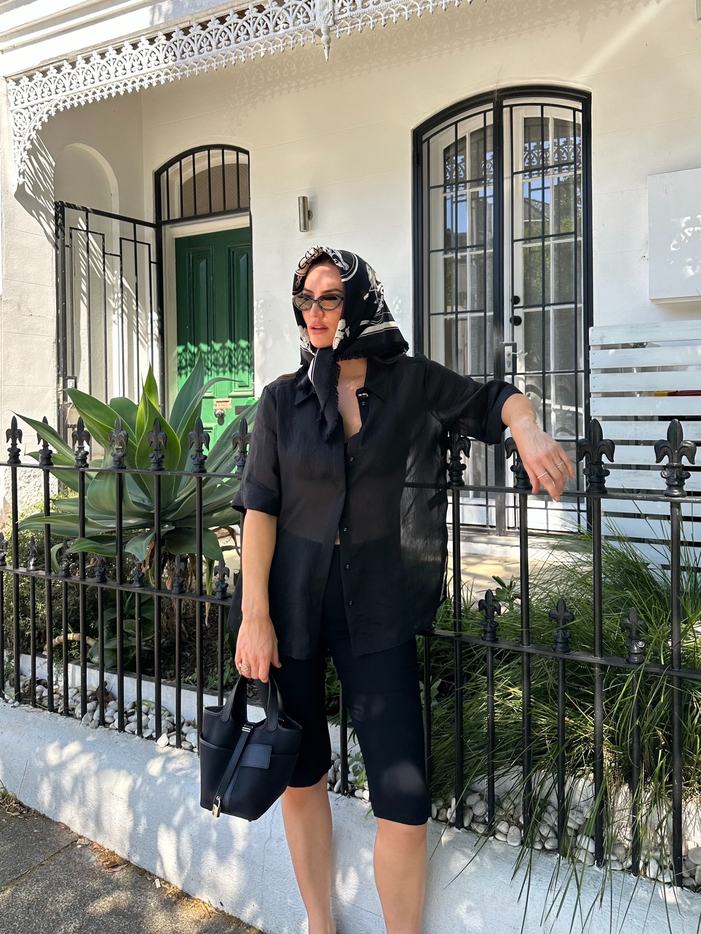 aymie cahill wears a black shirt, black capri trousers and a headscarf