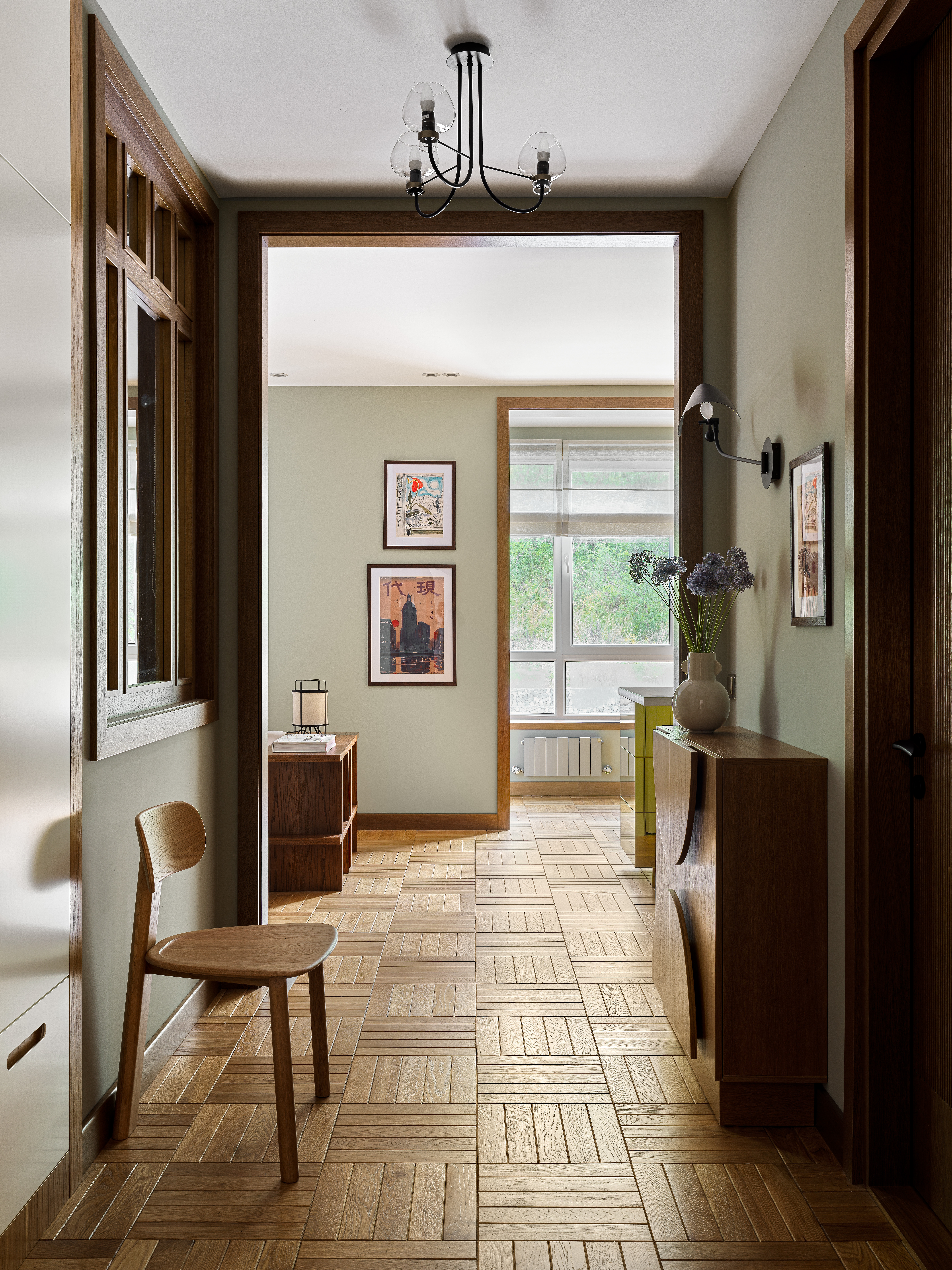 A gallery with natural oak flooring in geometric patterns