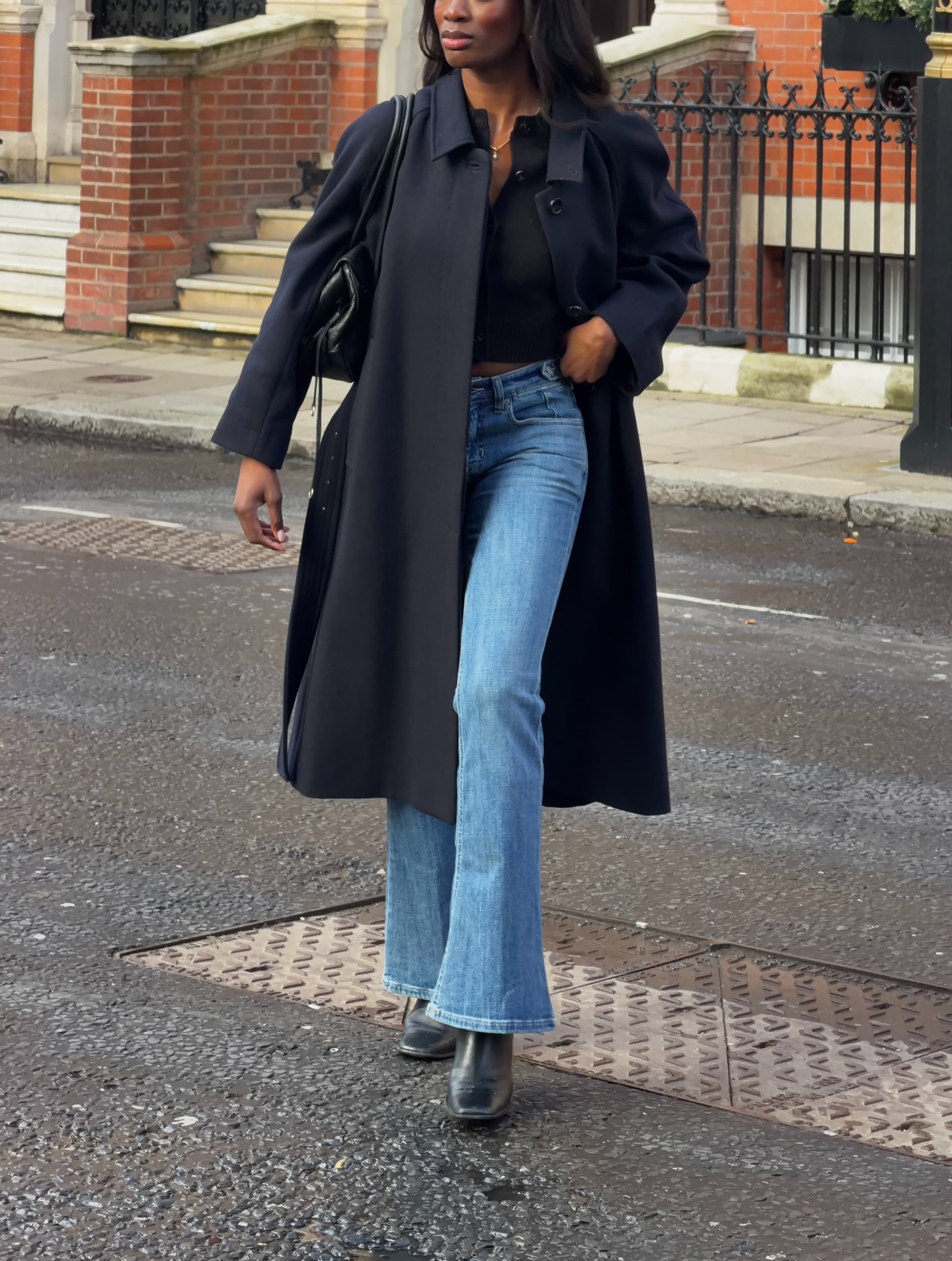 @_livmadeline wearing a sweater and jeans