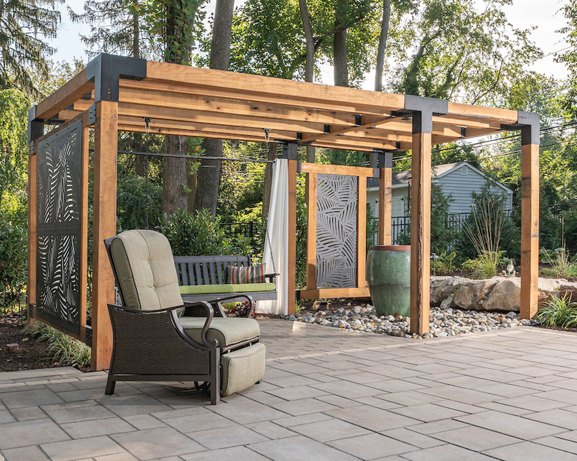 wooden pergola on patio with garden furniture