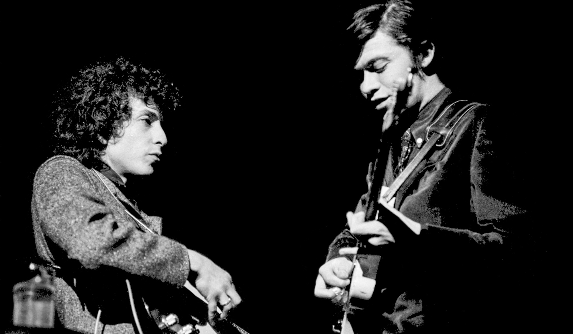 Bob Dylan (left) and Robbie Robertson, onstage at the Academy of Music in Philadelphia, Pennsylvania on February 24, 1966
