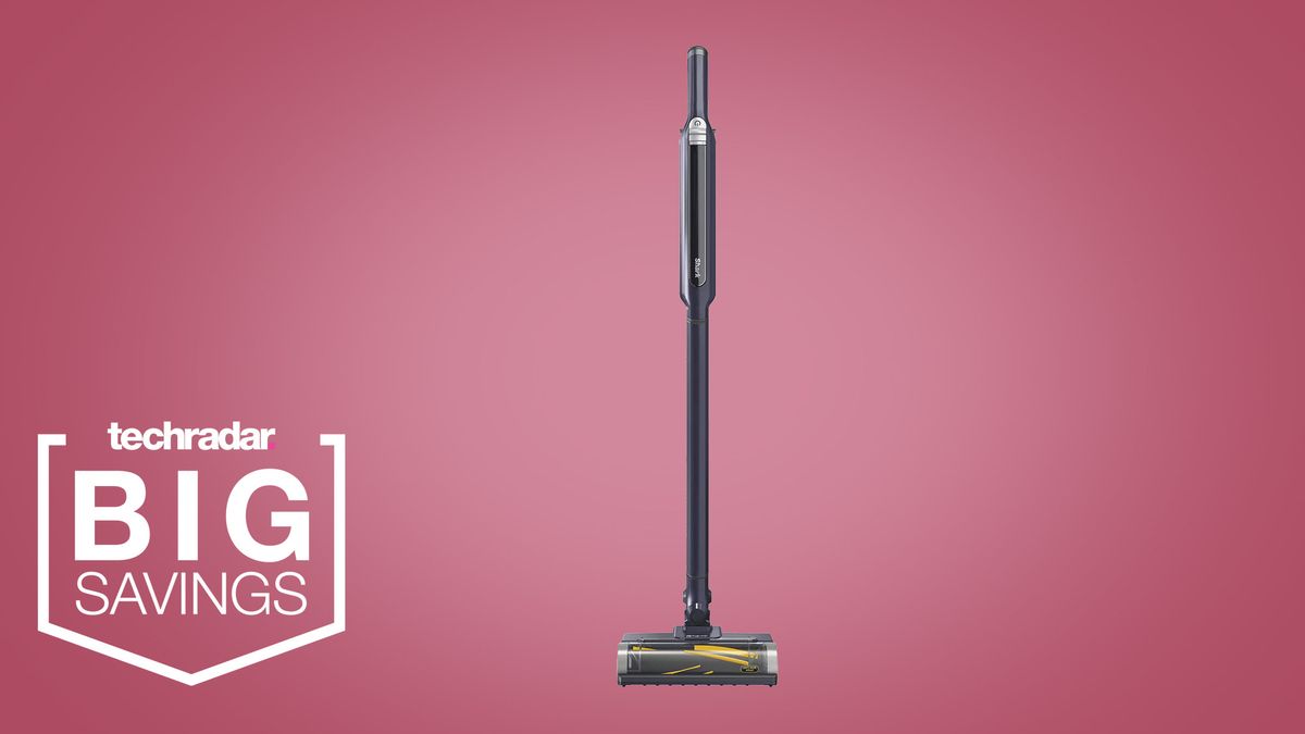 the Shark WandVac on a pink background