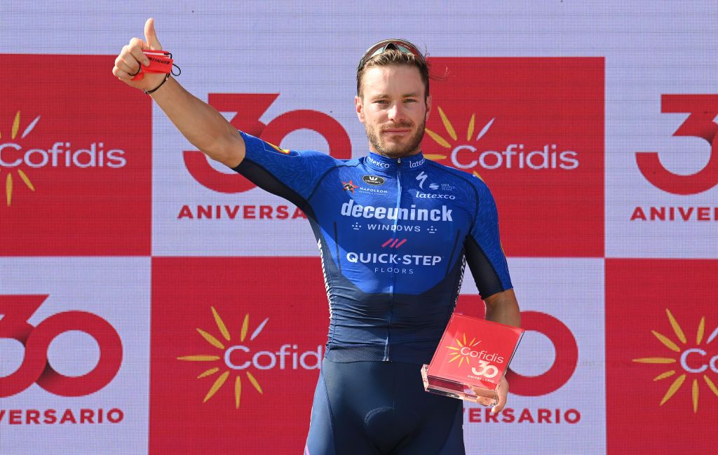 VILLANUEVA DE LA SERENA SPAIN AUGUST 27 Florian Senechal of France and Team Deceuninck QuickStep celebrates winning the stage on the podium ceremony after the 76th Tour of Spain 2021 Stage 13 a 2037km stage from Belmez to Villanueva de la Serena lavuelta LaVuelta21 on August 27 2021 in Villanueva de la Serena Spain Photo by Stuart FranklinGetty Images