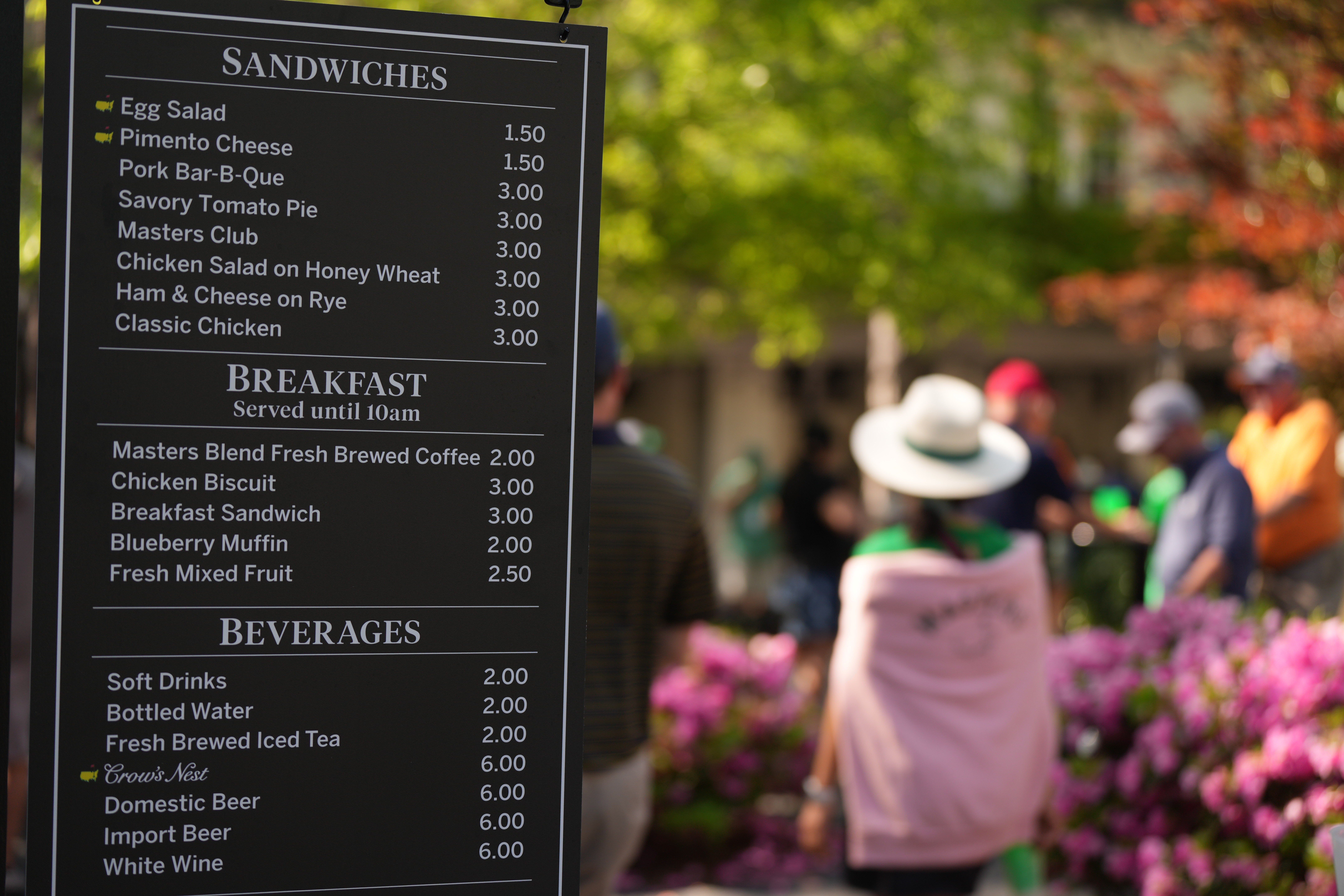 A board with Masters concessions' food and drink prices