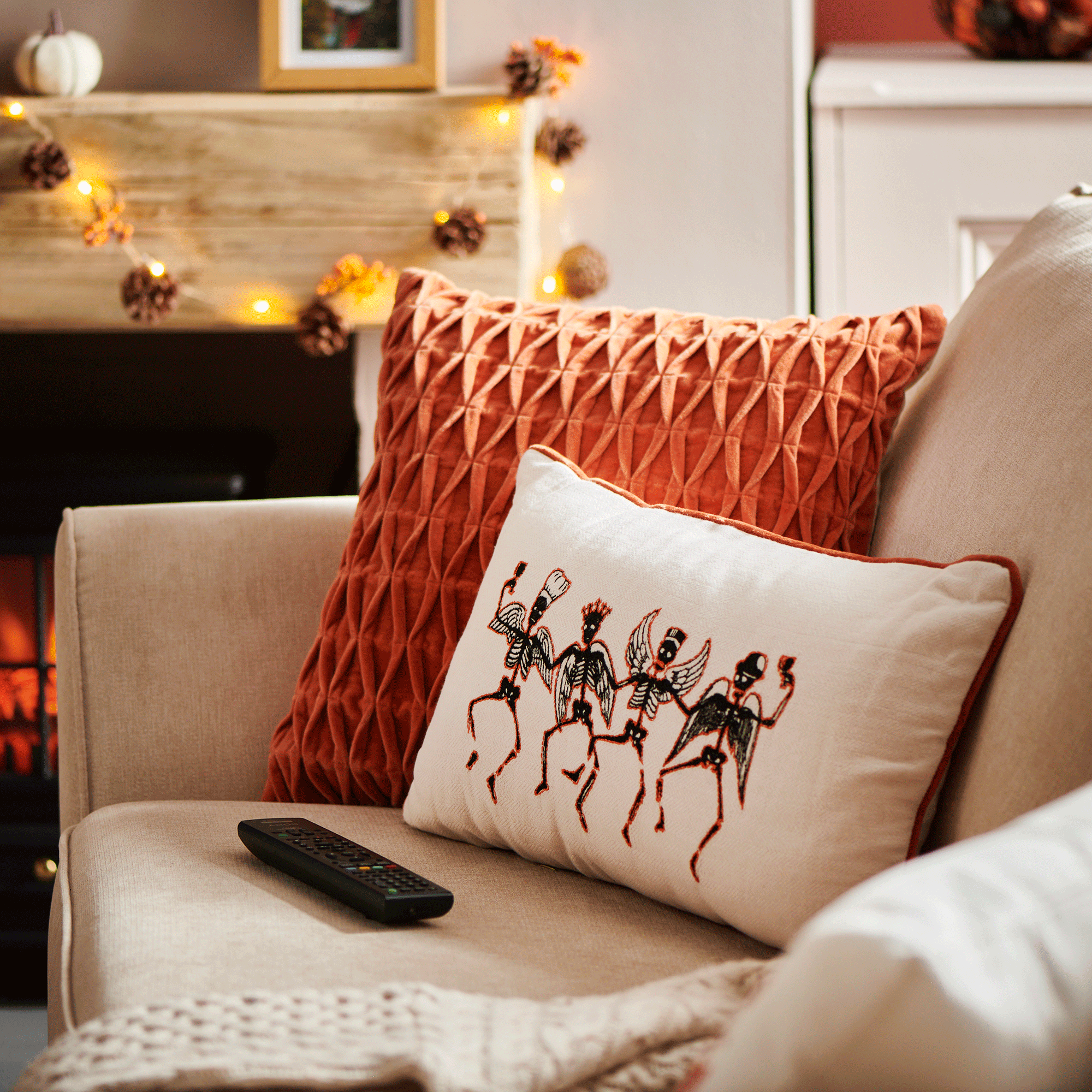 Halloween skull cushion on sofa