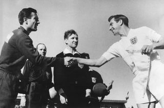 Argentina and England captains shake hands ahead of a match at the 1962 World Cup.