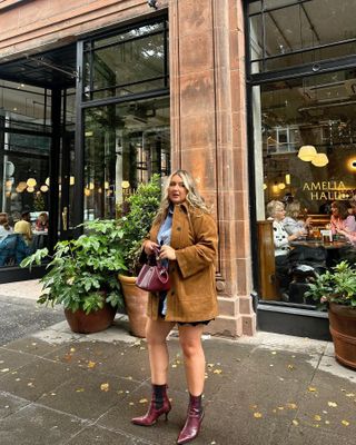 Influencer winter wishlist: @mariamacfarlanee wears a suede jacket with burgundy boots