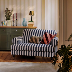 Coast Navy Striped Love Chair in a modern living room.