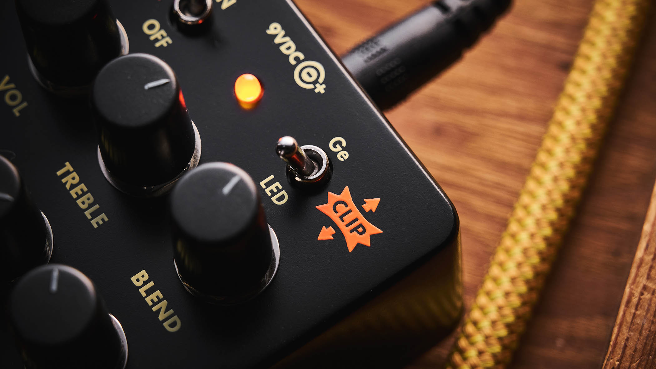 Electro-Harmonix Bender Royale &amp;ndash; the feature-packed fuzz pedal is finished in a black enclosure with orange graphics/text, and is photographed here in warm tones against a wooden background.