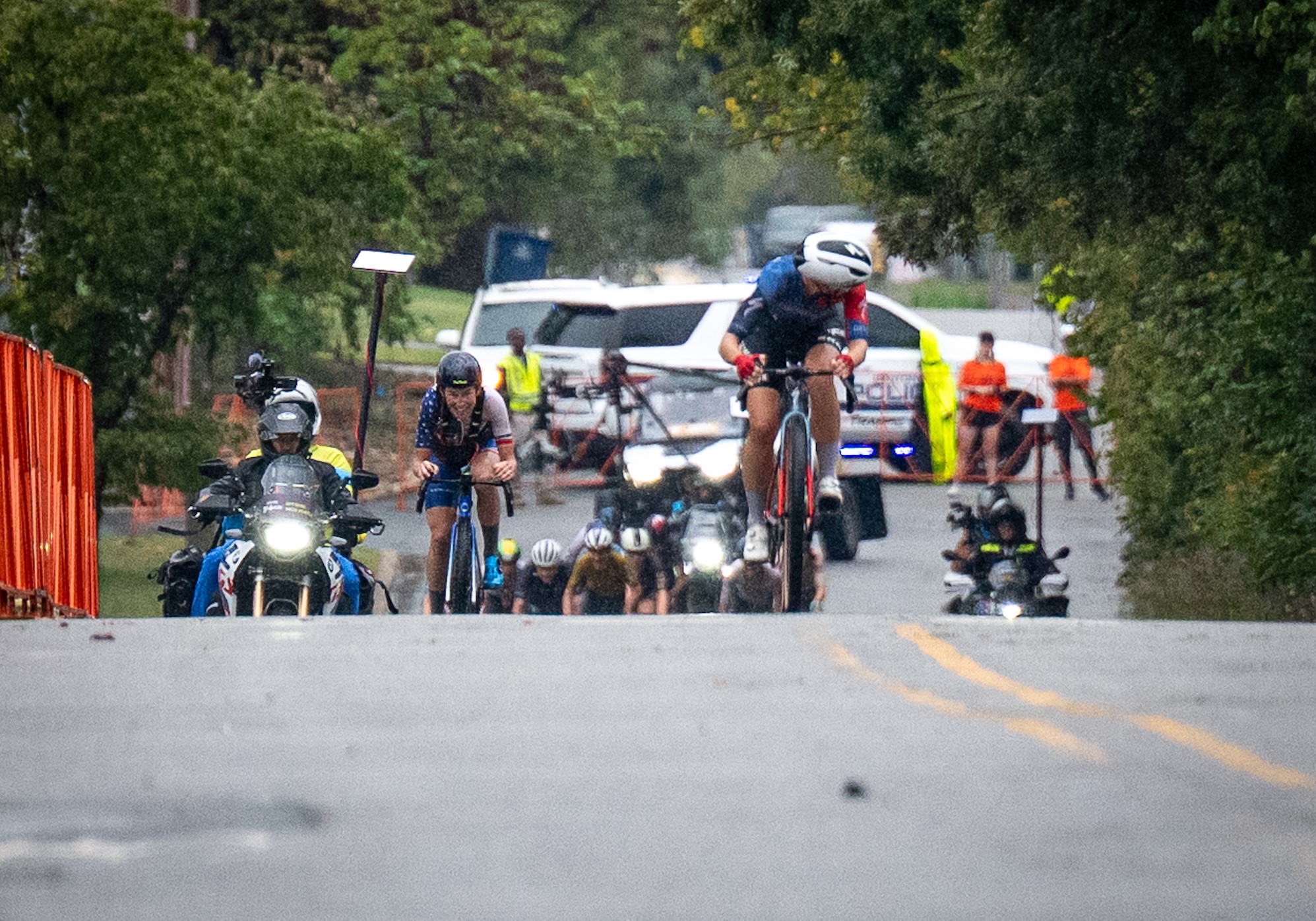 2025 Big Sugar Gravel winner Sofia Gomez Villafa&amp;ntilde;e checks on chasers as she heads to the finish in Bentonville