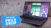 Asus Vivobook 15 laptop shown with a Tom's Guide price drop tag
