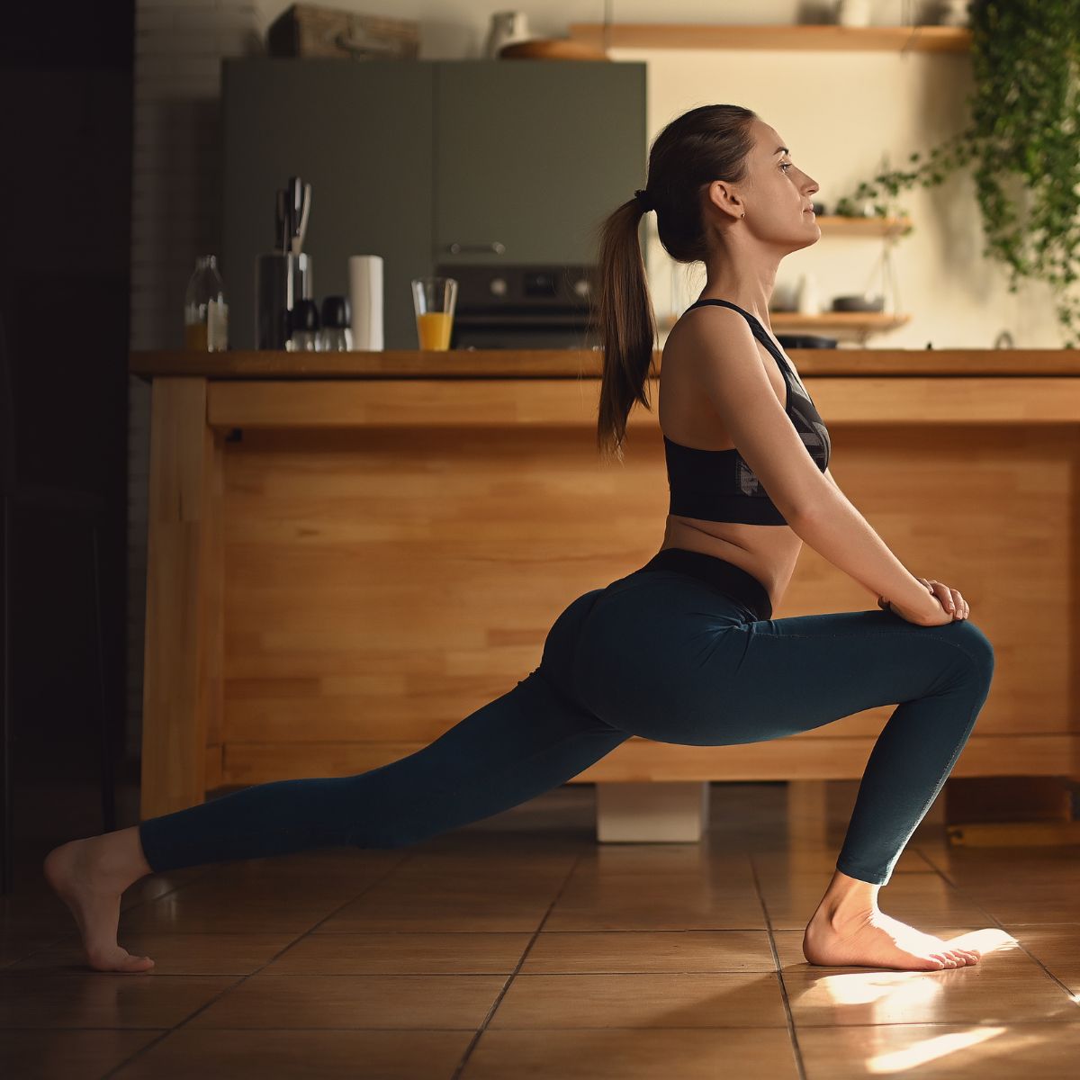 Indoor workouts: A woman stretching indoors