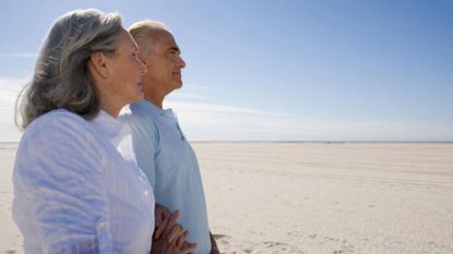 An older couple look off into the distance