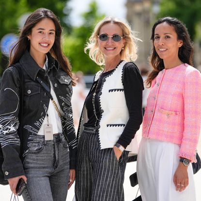Three women photographed on the street during fashion week