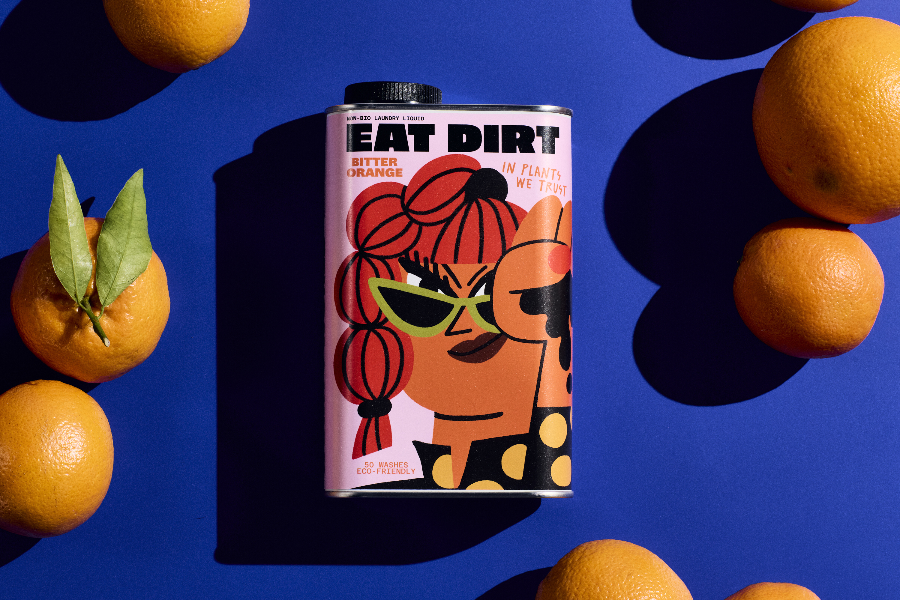 Eat Dirt laundry detergent in an illustrated tin