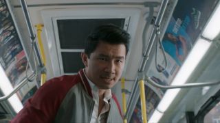 Simu Liu as Shang-Chi in bus fight scene
