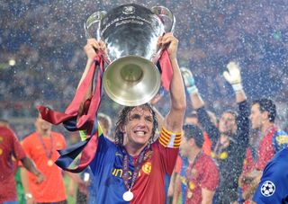 Barcelona captain Carles Puyol celebrates with the Champions League trophy after his side's win over Manchester United in the 2009 final.