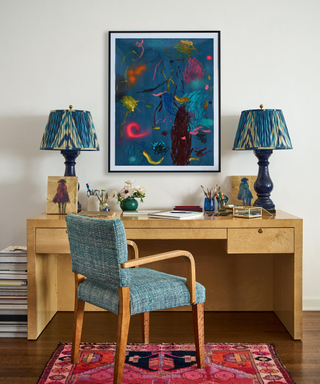 Office space with Burl desk, colorful rug and accent table lamps