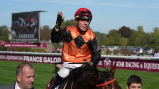 Italian jockey Cristian Demuro riding Favourite Ace Impact celebrates after winning the Qatar Prix de l'Arc de Triomphe horse race at the Paris Longchamp racecourse in Paris ahead of the 2024 L'Acr de Triomphe