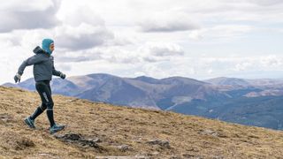 Sabrina Verjee descends from Low Man Skiddaw in a strong wind during her Wainwrights run - copyright Steve Ashworth-2 2.jpeg Sabrina Verjee descends from Low Man Skiddaw in a strong wind during her Wainwrights run