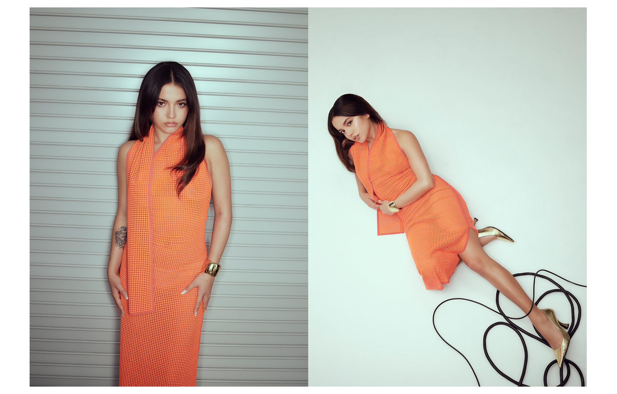 Isabela Merced poses wearing neon orange dress by Fendi.