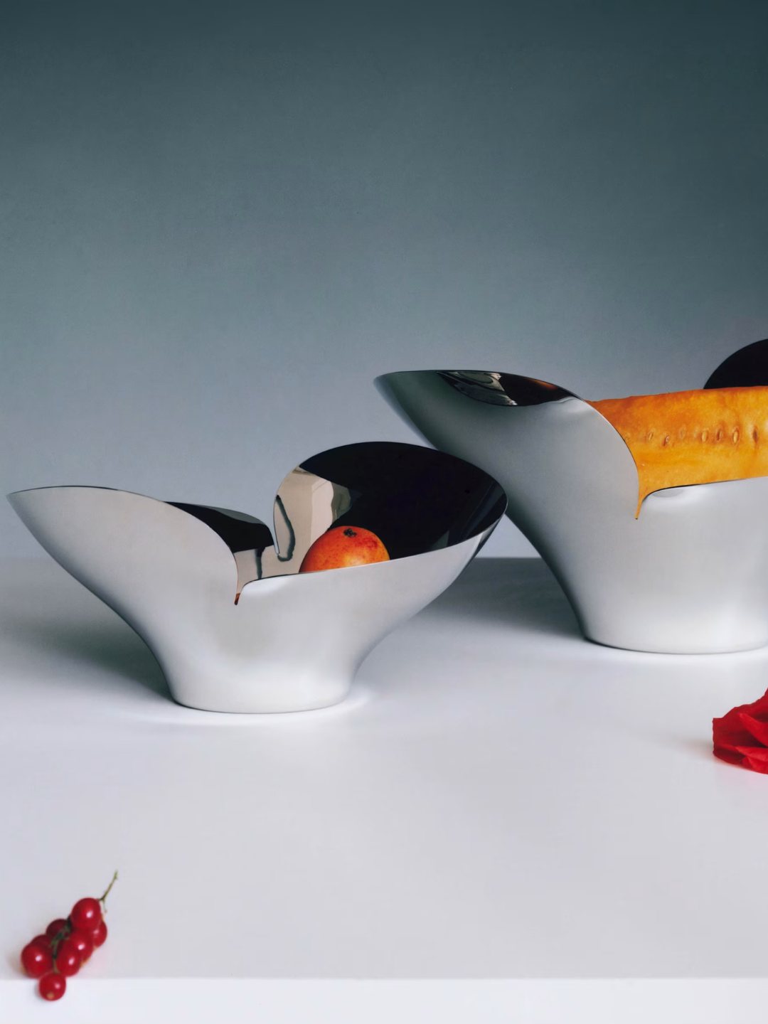 A pair of chrome low flower-shaped bowls