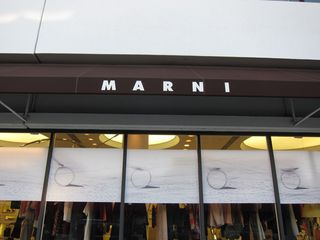 The Marni store window, lined with decals of stills from 'On Marni'
