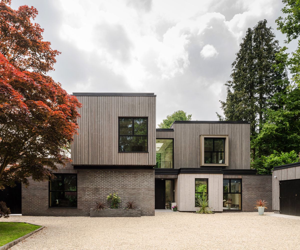 Front exterior of a contemporary self build home with bold geometric forms