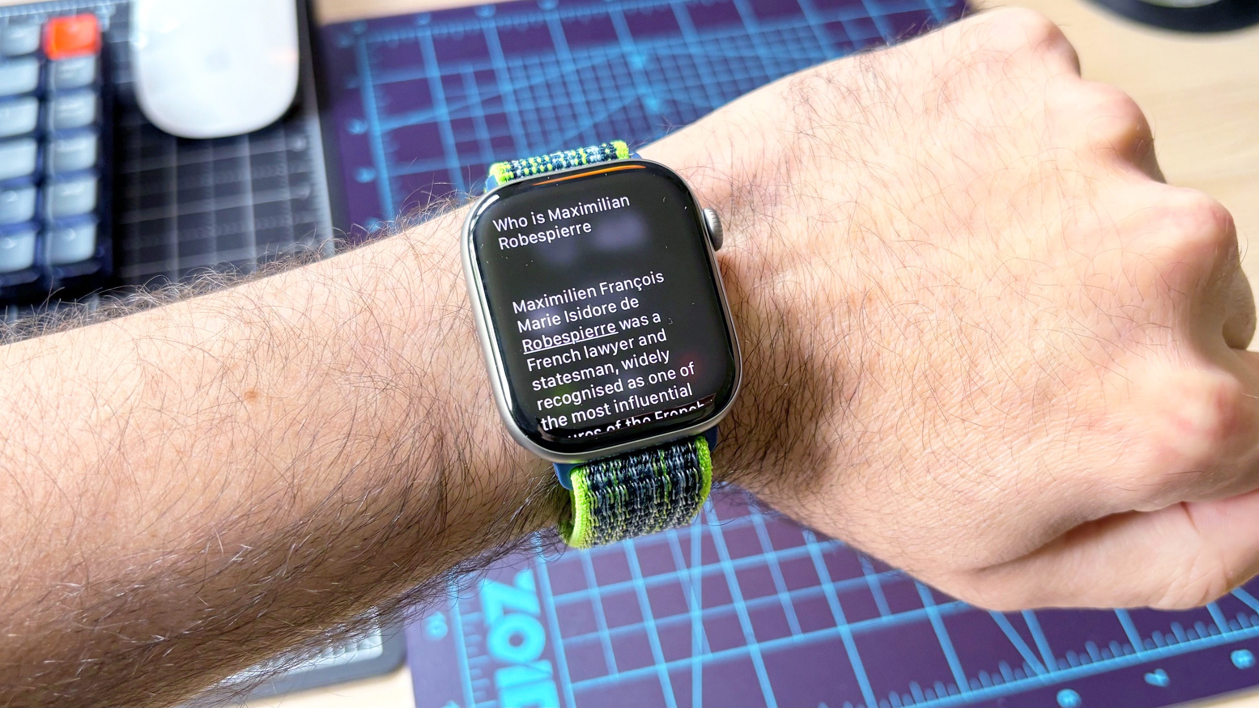 Close-up of the Siri AI setup process using an Apple Watch 11 and iPhone 16 Plus