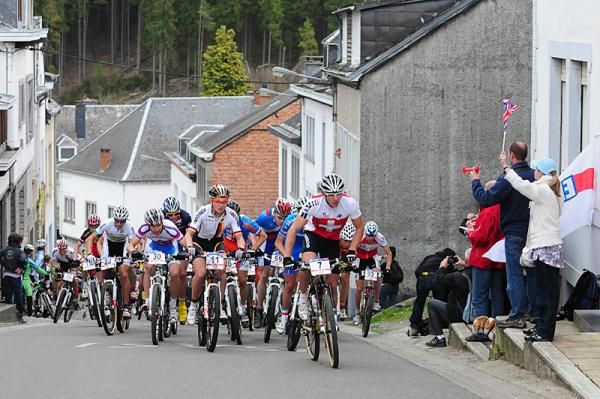 Riders tackle a steep climb painted with the names of the Schleck brothers.
