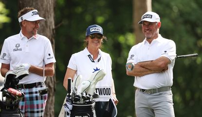Poulter and Westwood and caddie chat on the tee