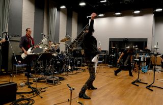 Rudy Schenker shows the band how to windmill