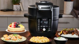 Instant Pot Duo Crisp with Ultimate Lid, surrounded by dishes