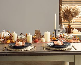Autumnal dining table with set of TruGlow® LED Candles and Pampas grass