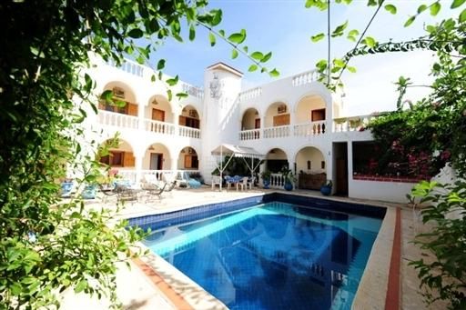 The courtyard inside La maison bleue, the hotel where Frank Vandenbroucke was found dead.