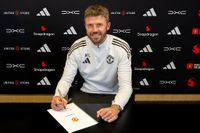 MANCHESTER, ENGLAND - MAY 22: (EXCLUSIVE COVERAGE) Head Coach Michael Carrick of Manchester United poses after signing a contract to remain as Head Coach at Carrington Training Ground on May 22, 2026 in Manchester, England. (Photo by Ash Donelon/Manchester United via Getty Images)