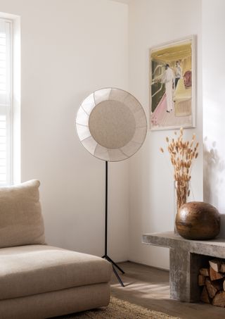 An floor lamp with an oversized linen shade