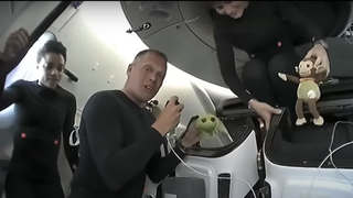 From left: Crew-4 members Jessica Watkins (NASA), Robert Hines (NASA) and (near top) Samantha Cristoforetti of the European Space Agency with their spacecraft mascots.