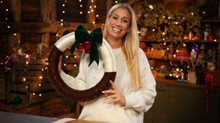 Stacey Solomon holding a Christmas wreath in Stacey Solomon’s Crafty Christmas