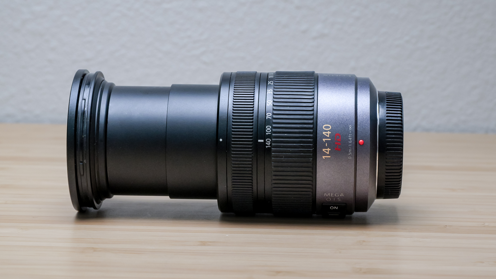 A 14-40mm Lumix lens on a worktop