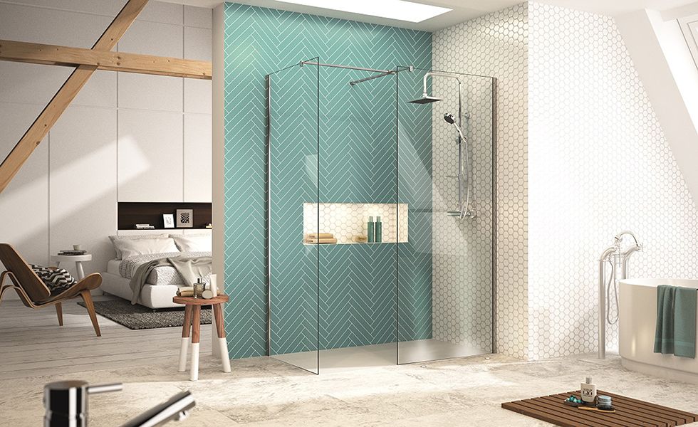 Walk in shower with glass screen and green tiles